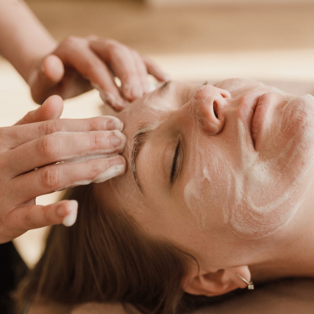 A woman receiving a soothing skin treatment during a relaxing spa session.