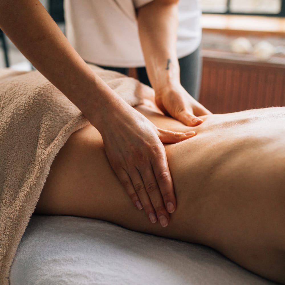 A woman experiencing a relaxing skincare session at a spa.