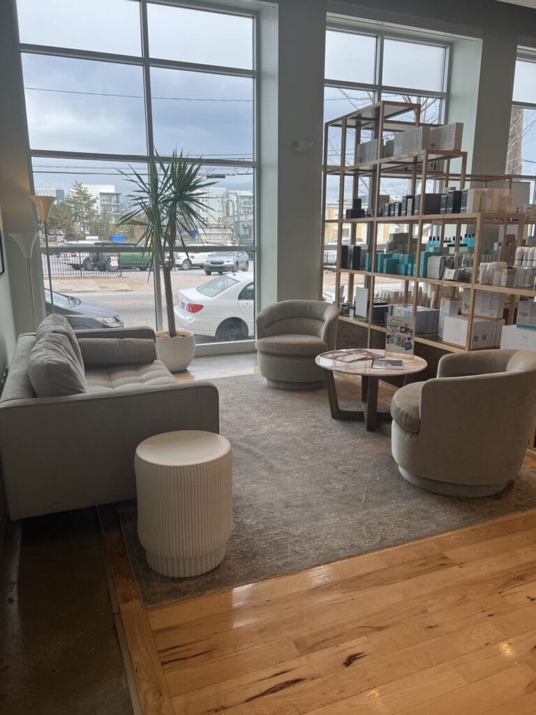 A living room with couches and spa-like ambiance.