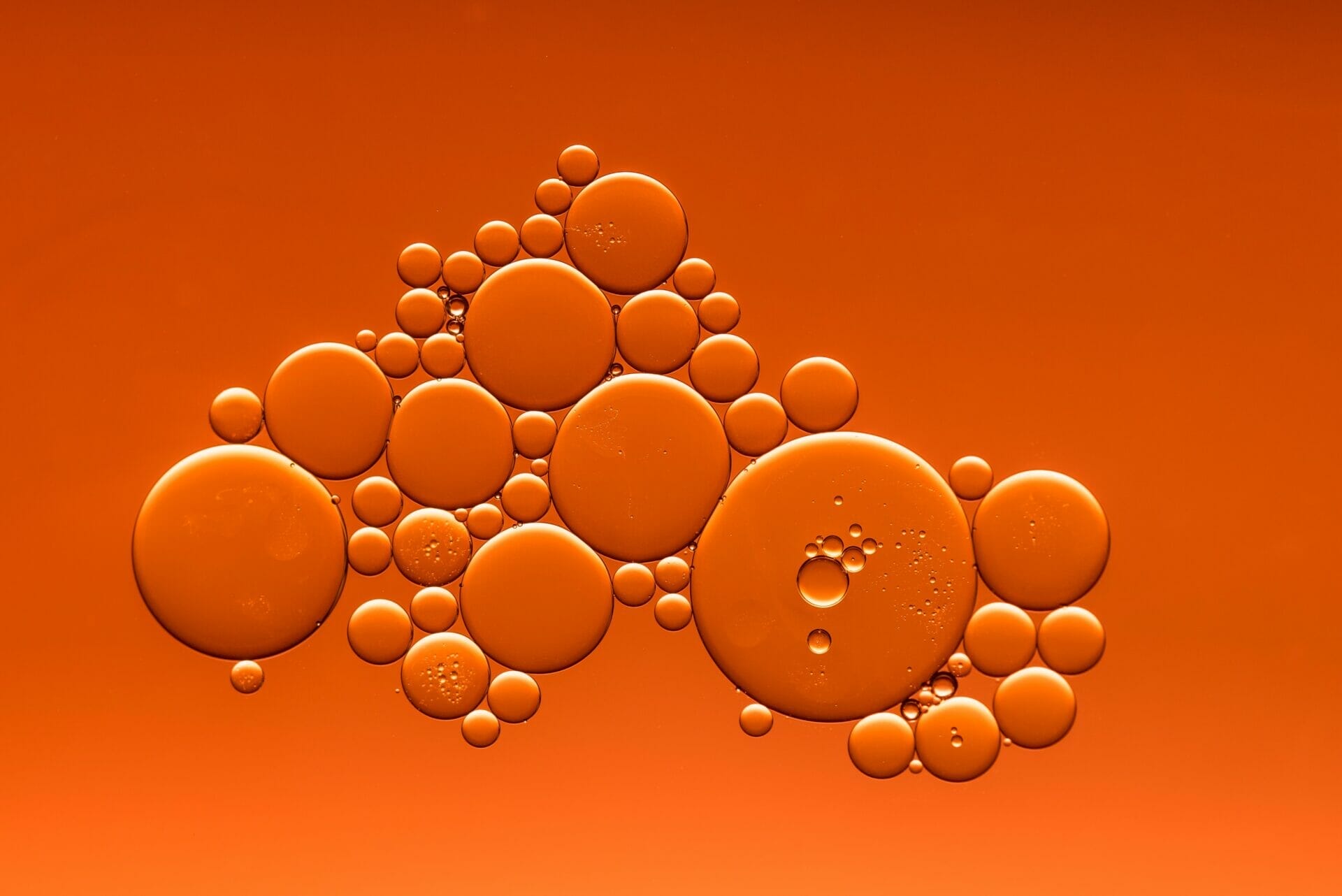Liquid bubbles on an orange background