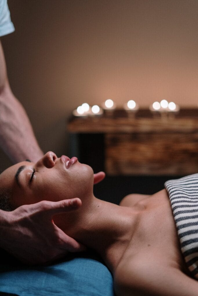 A woman trying lymphatic drainage massage at a spa.